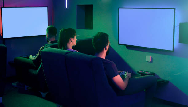 Group of friends playing games on big lcd screen